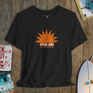 Black t-shirt with a sun graphic and text on a wooden surface