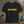 Black t-shirt with 'CLASSIC' in orange on a wooden surface with vintage camera and photos.