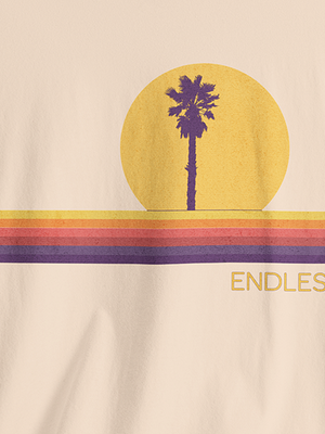 Natural t-shirt with a palm tree and sunset design and 'ENDLESS' text.
