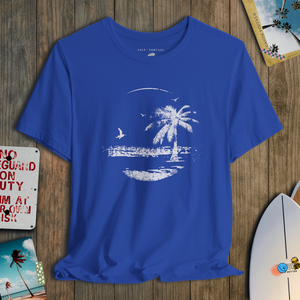 Blue t-shirt with a palm tree design on a wooden surface